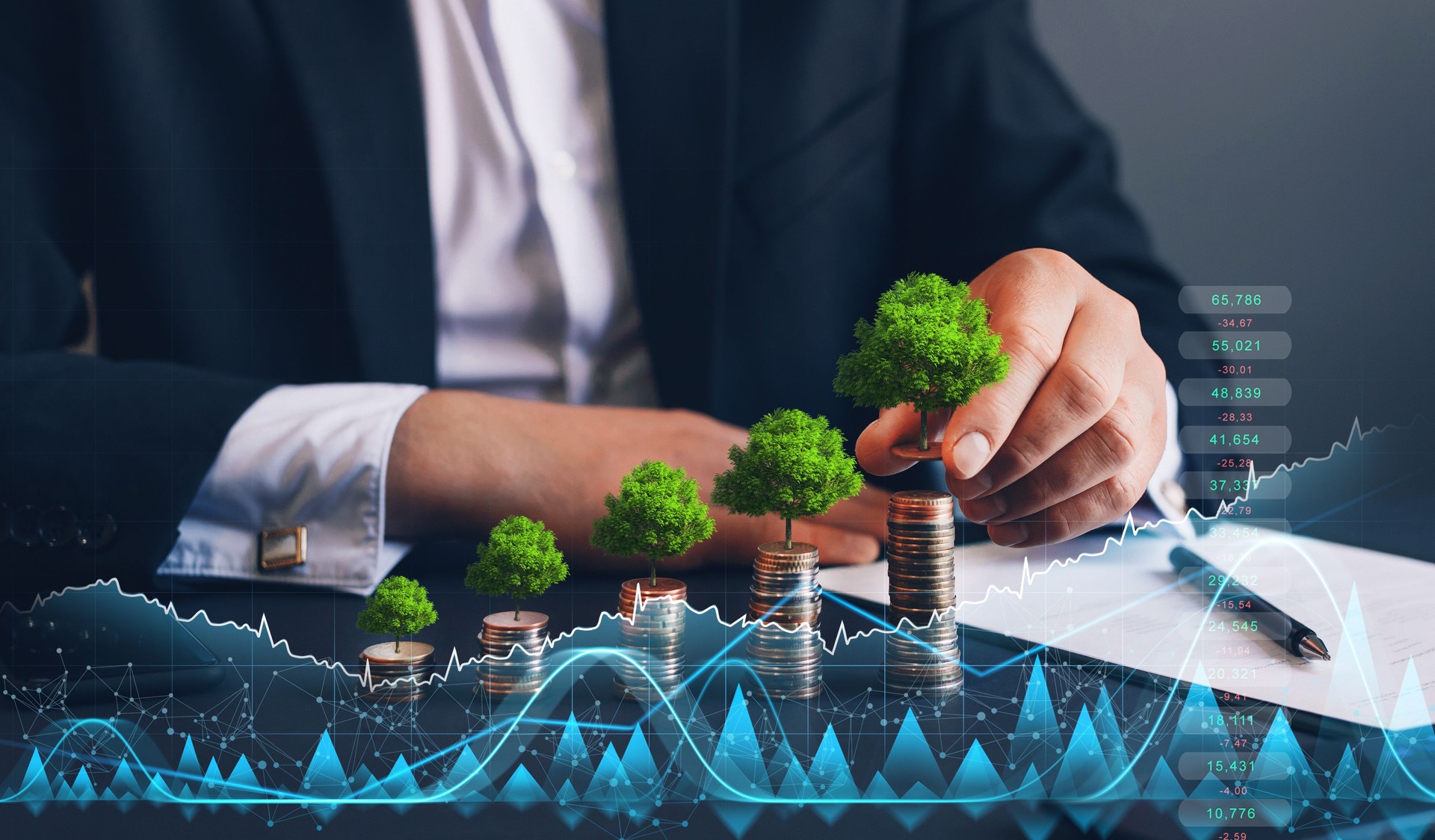 Businessman holding coin with tree growing on money coin stack and digital growth graph. Green business growth. Finance sustainable development.